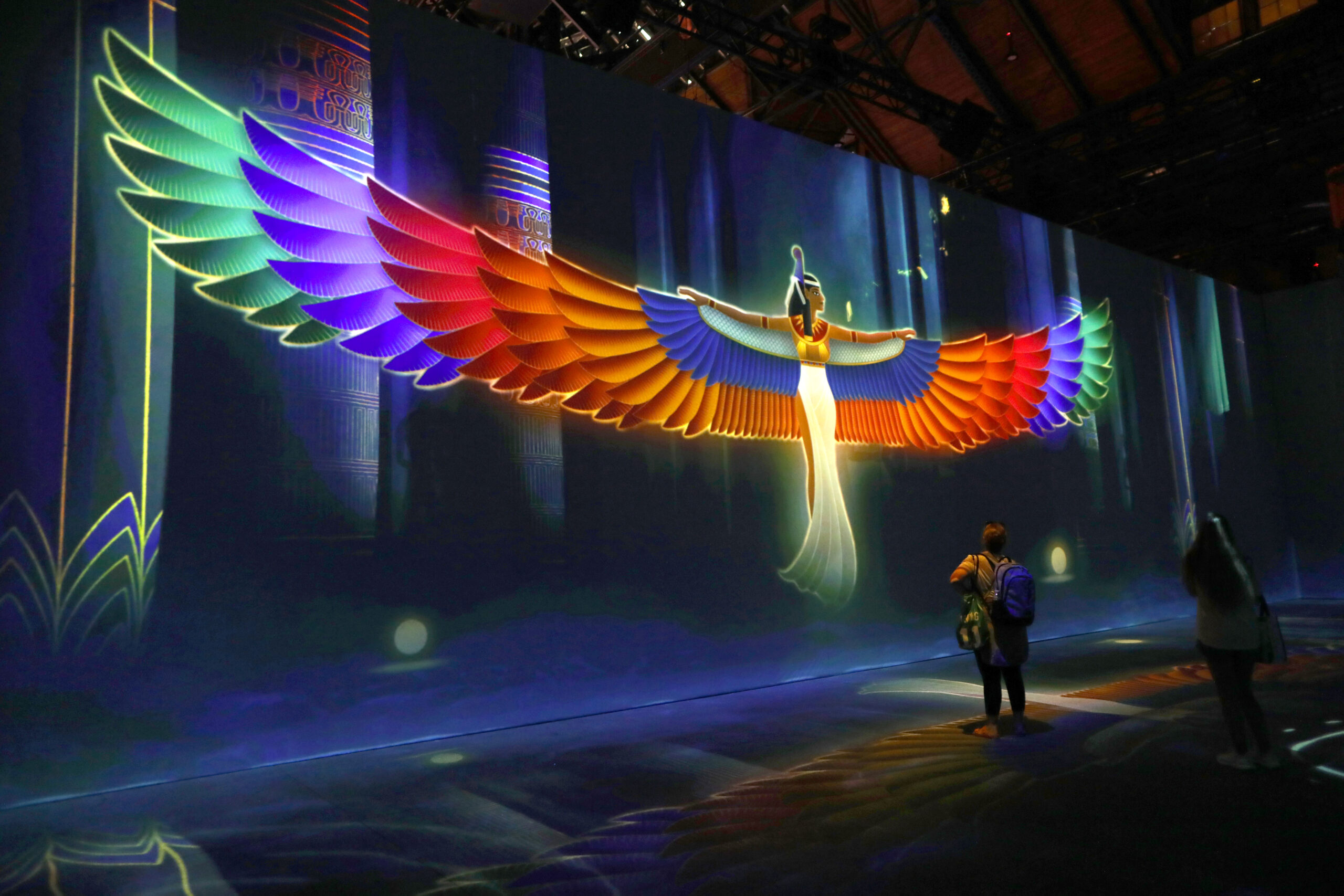 A projected image of the goddess Isis with wings spread - in one of the Beyond King Tut Immersive exhibit rooms