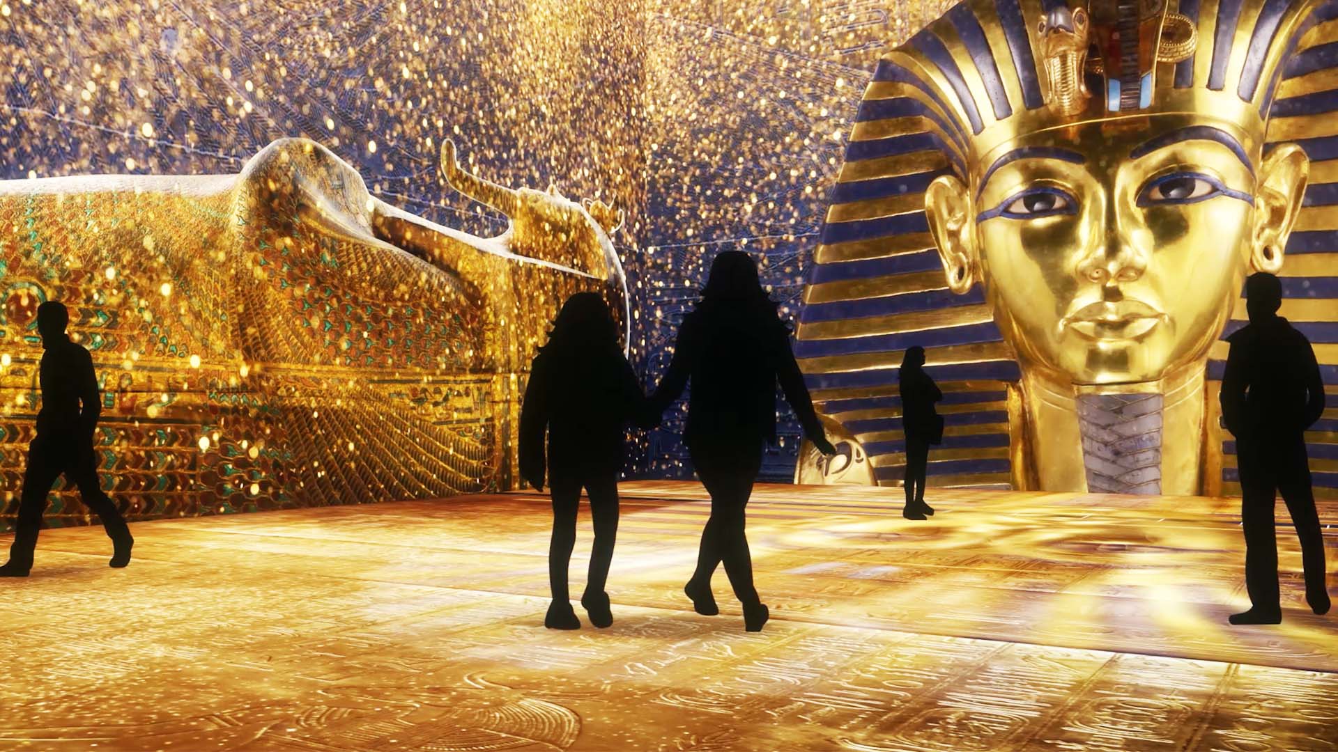 King Tut's Mask and Coffins against a luminous background envelops the visitor: Beyond KingTut